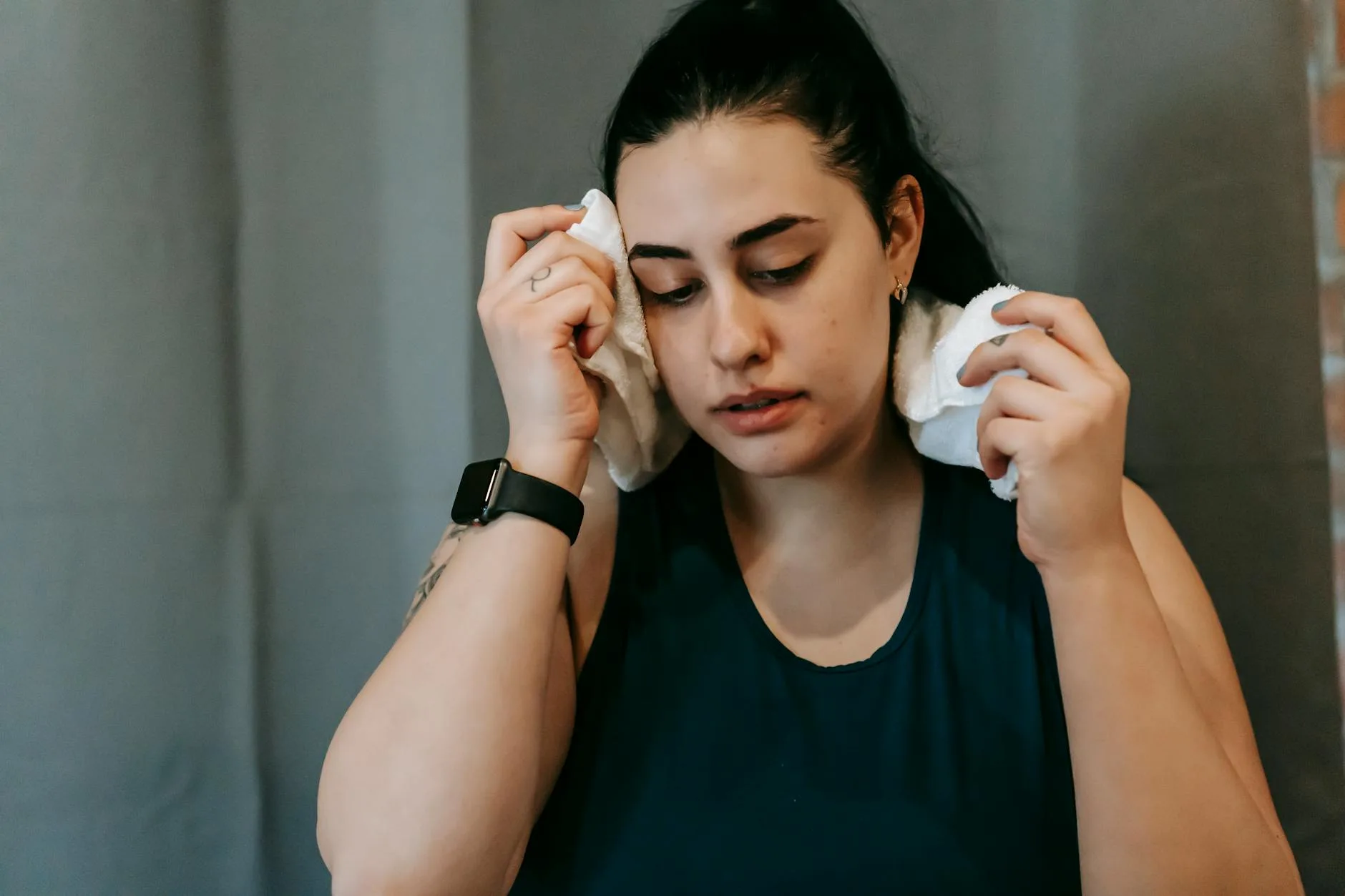 Athlete wiping hands with a towel during a sports break