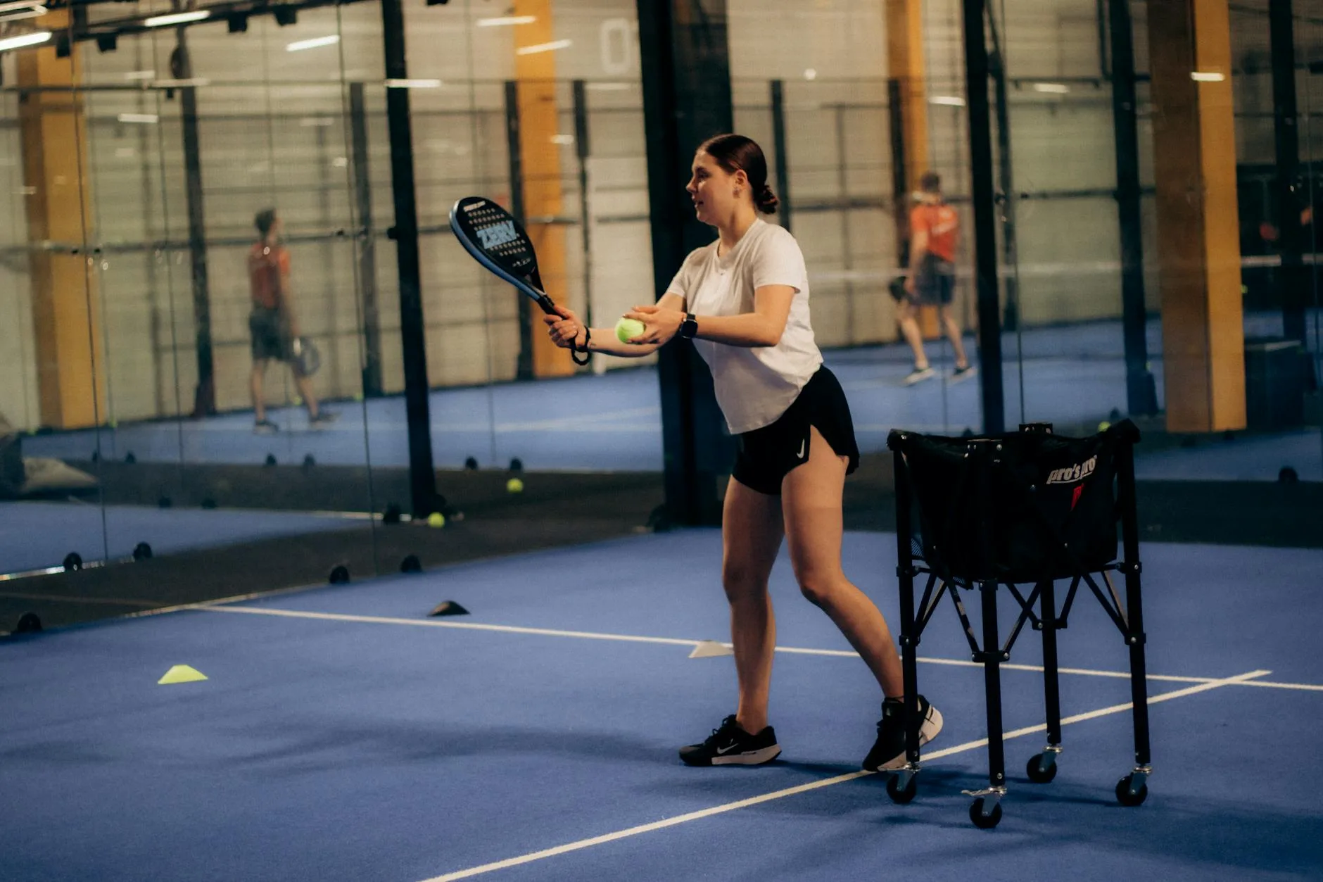 Modern indoor padel court facility with multiple courts