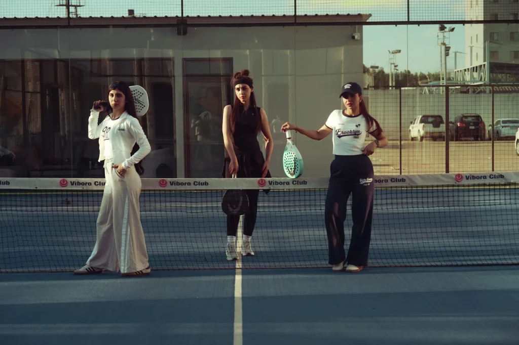 Player in action on a padel court during a match