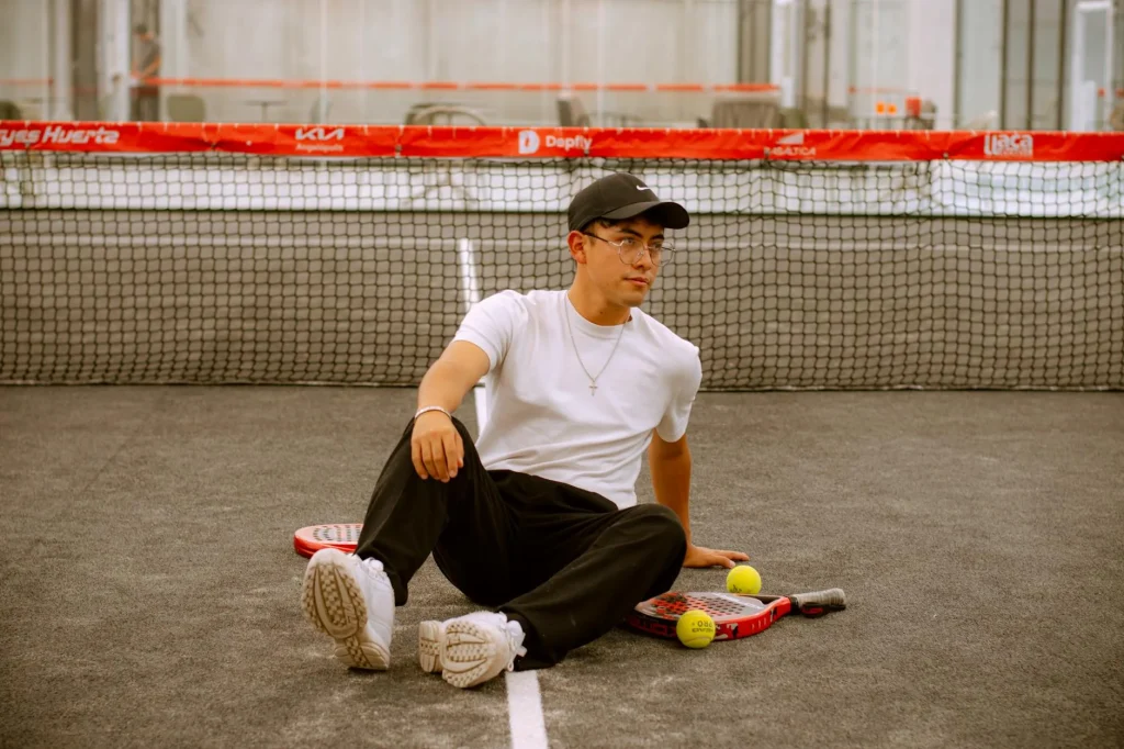 Padel racket with solid face and grip detail