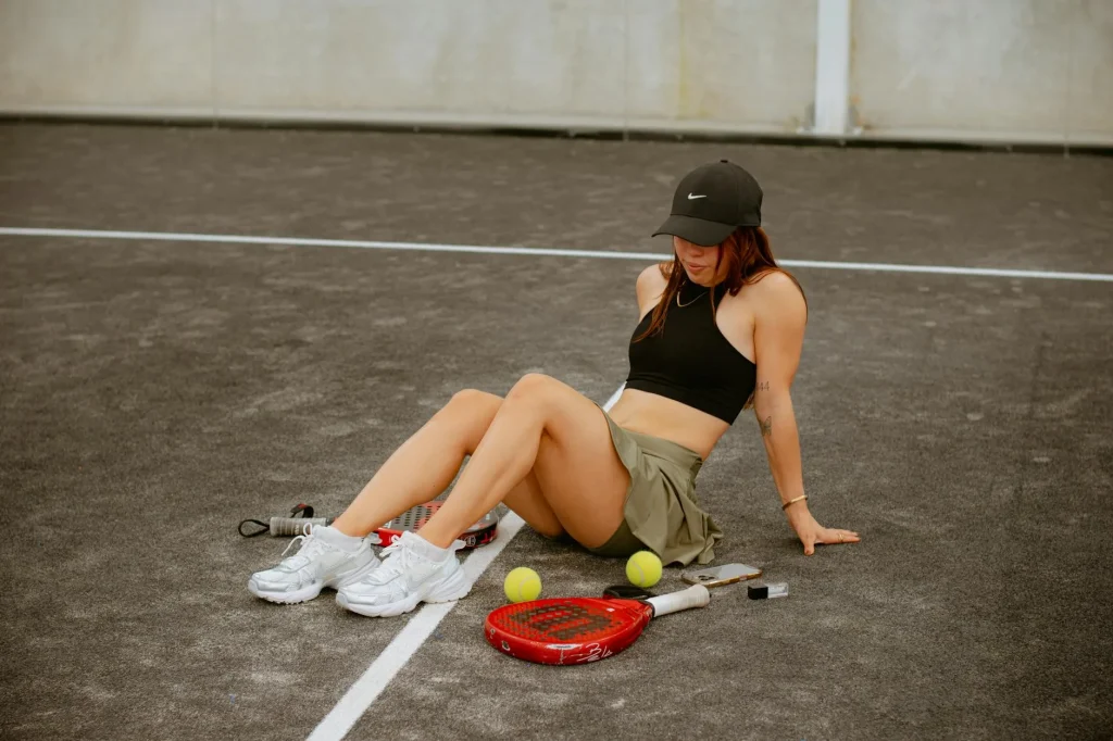 Padel rackets from different brands laid on court