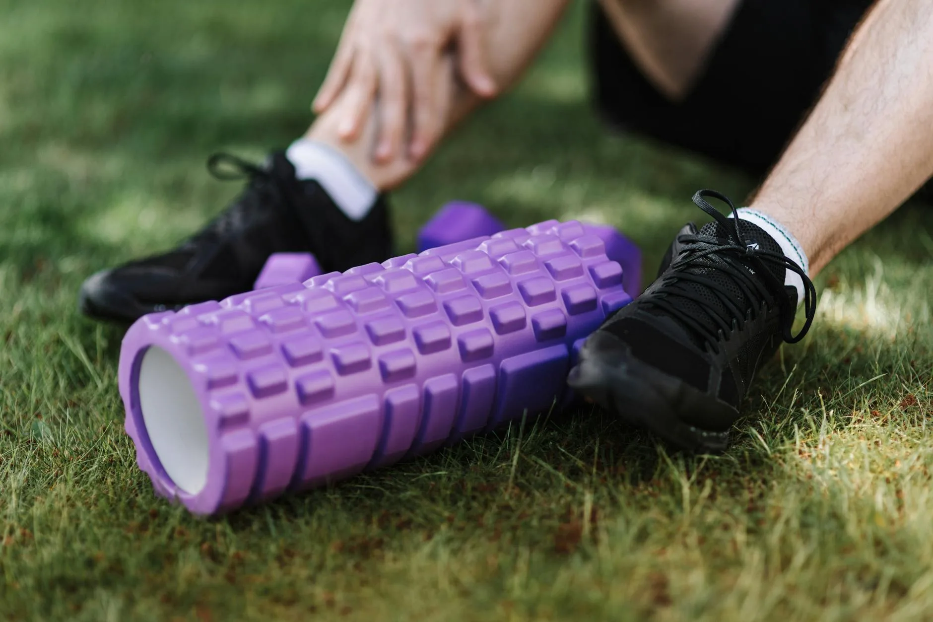 Athlete stretching legs during post-exercise recovery
