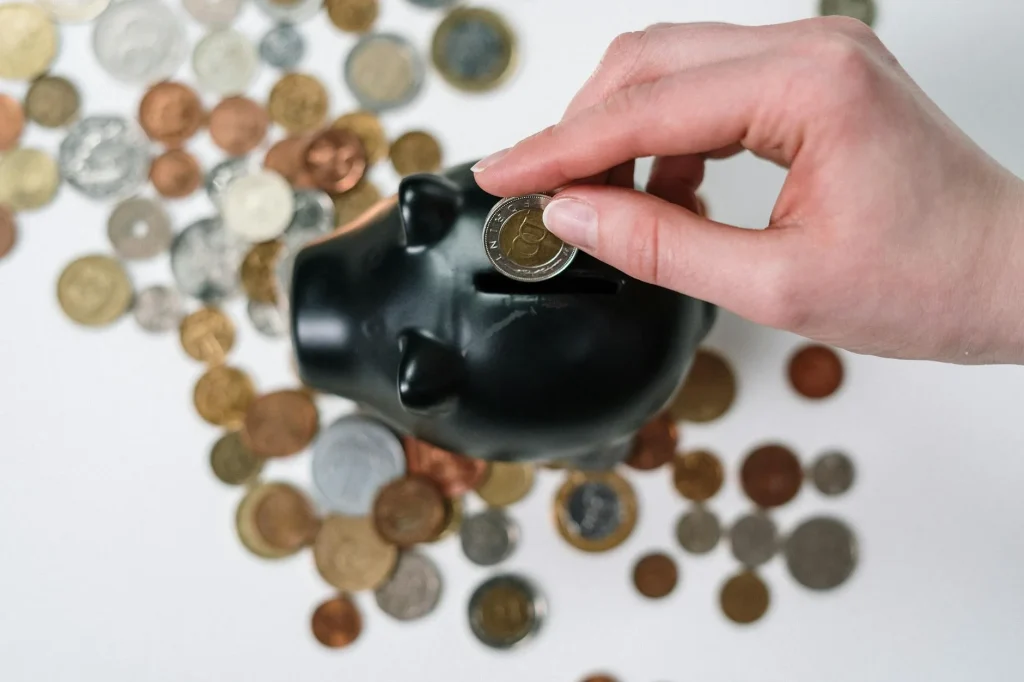 Pound coins and notes representing sports equipment budget planning
