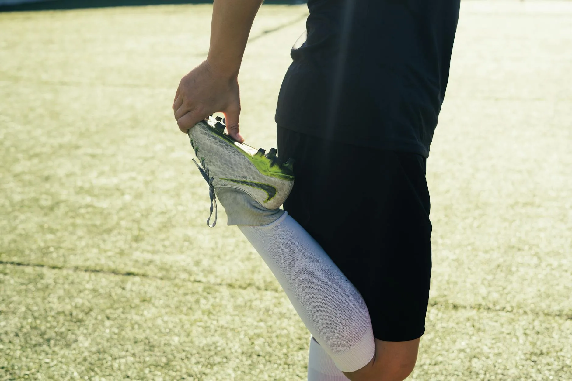 UK padel player performing dynamic stretching exercises before play