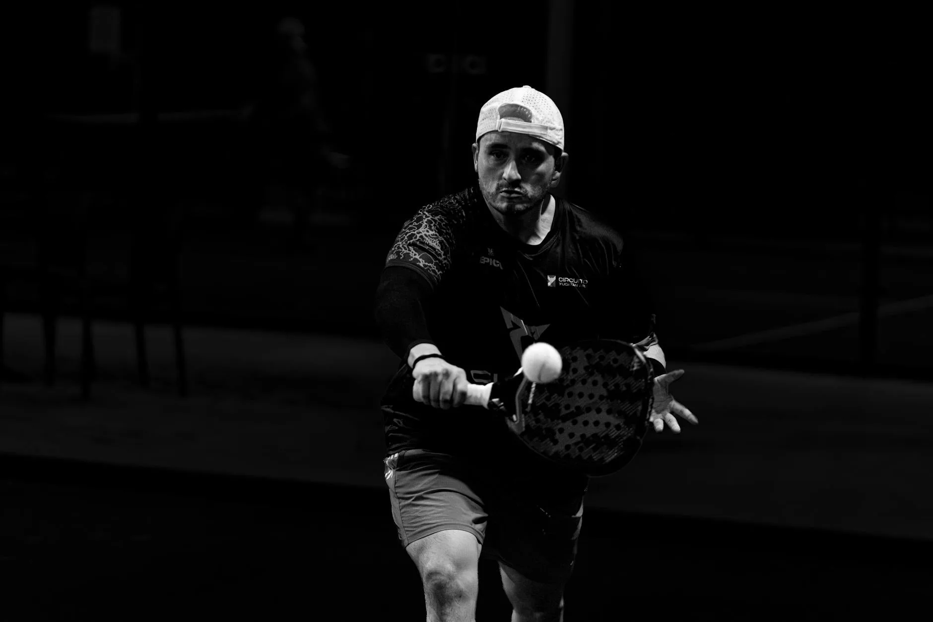 Padel players warming up in an indoor British sports facility