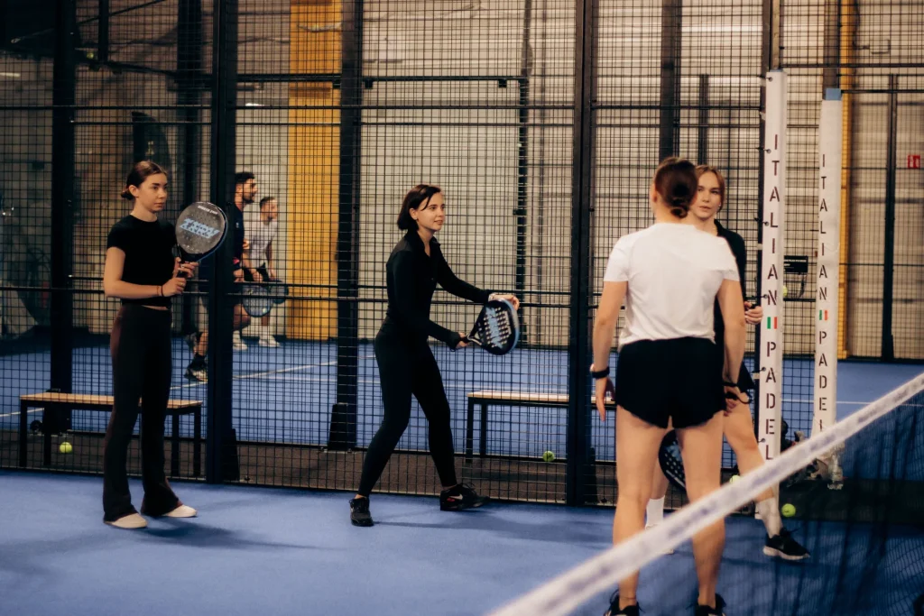Padel players with solid padel rackets on an indoor court