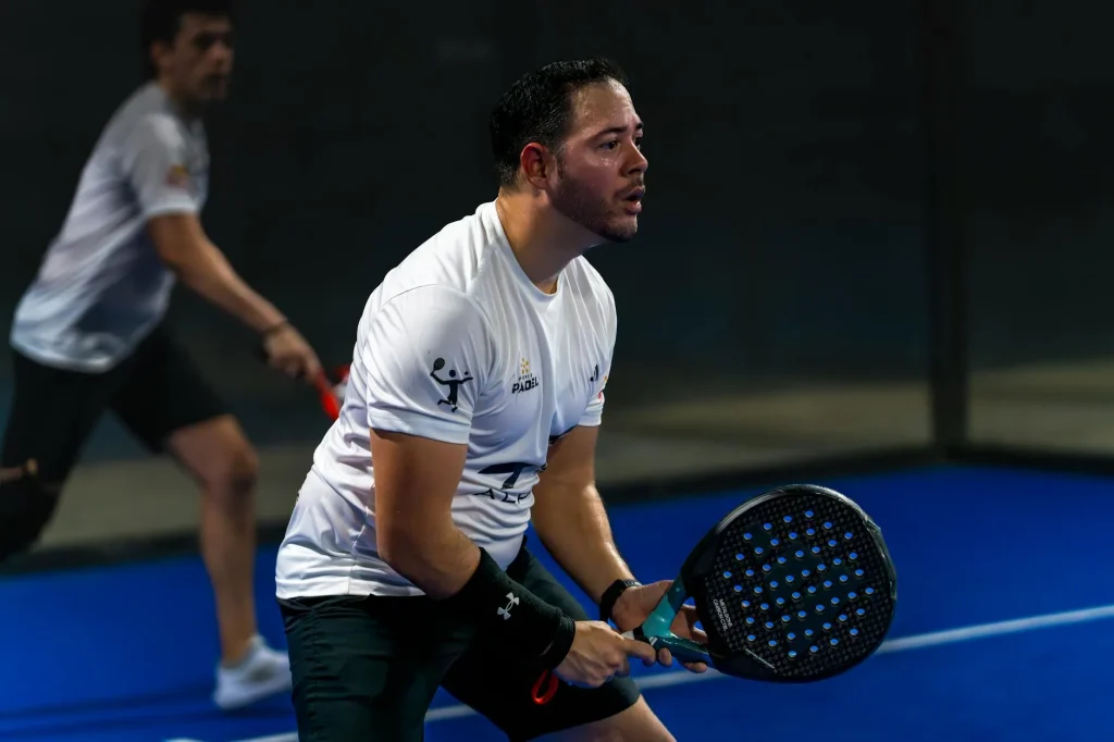 Players on indoor padel courts at a modern club